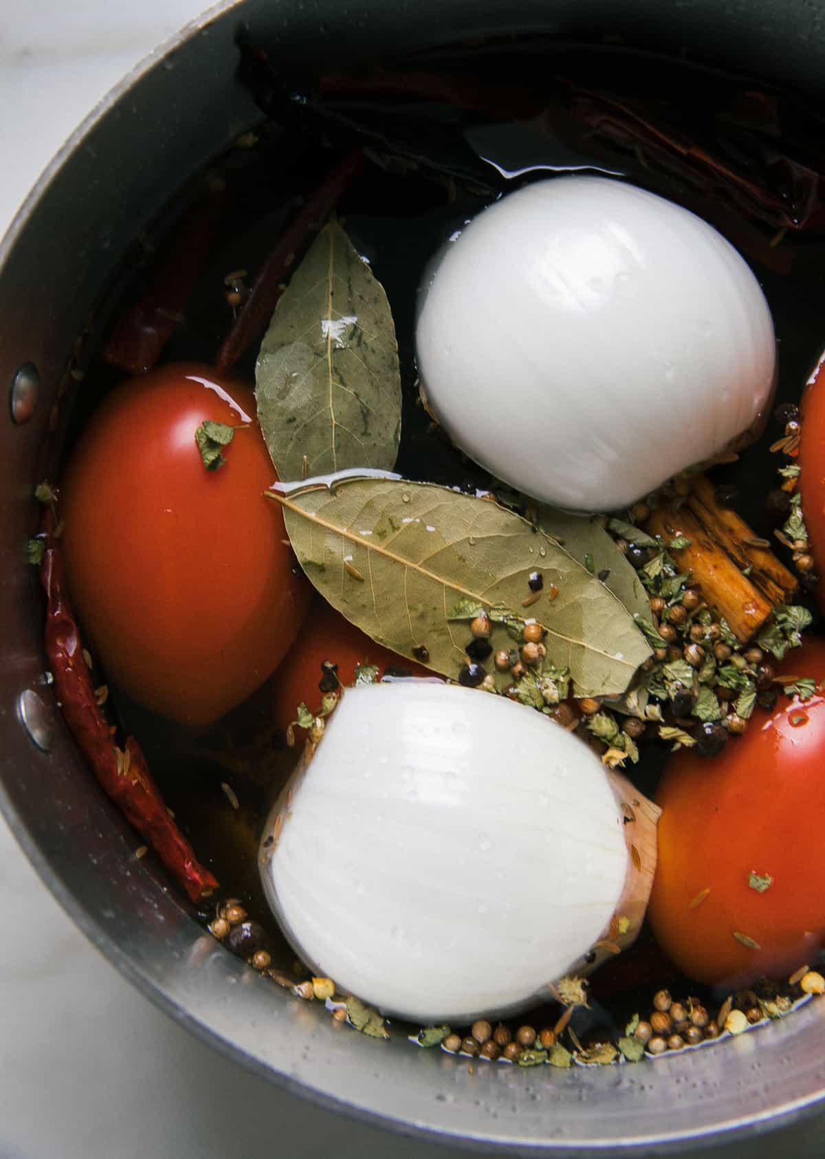 Onion and tomato boiling.