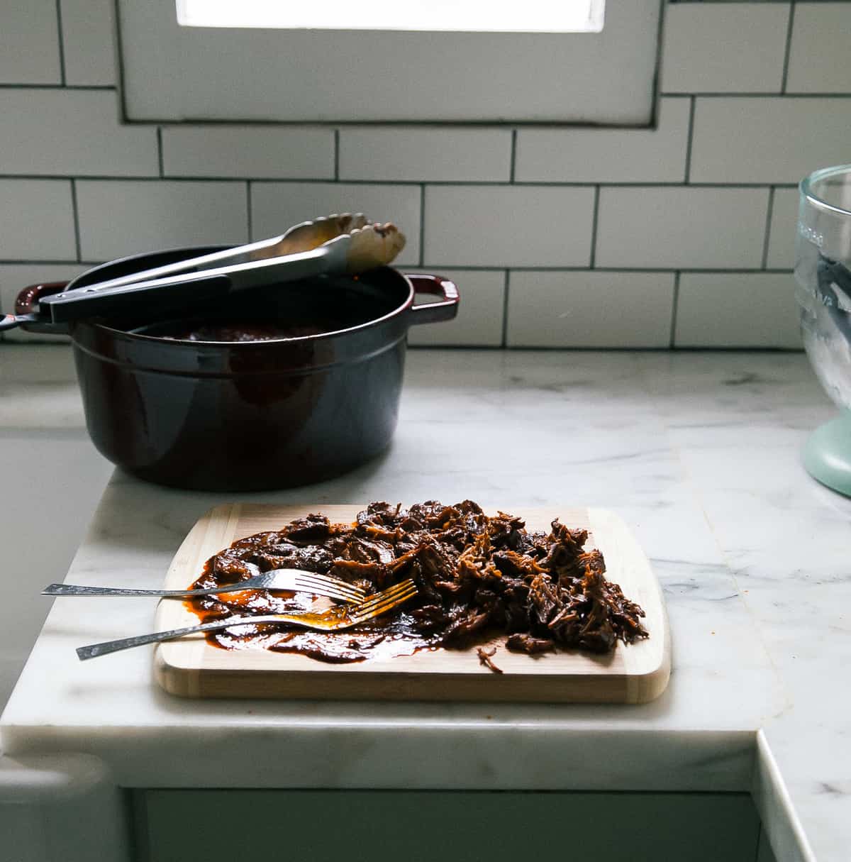 Meat shredded on cutting board