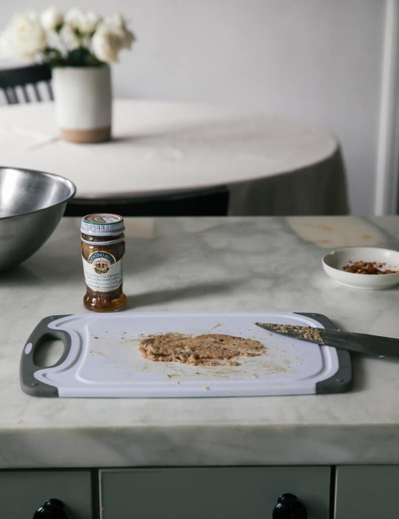 Anchovy garlic paste on cutting board