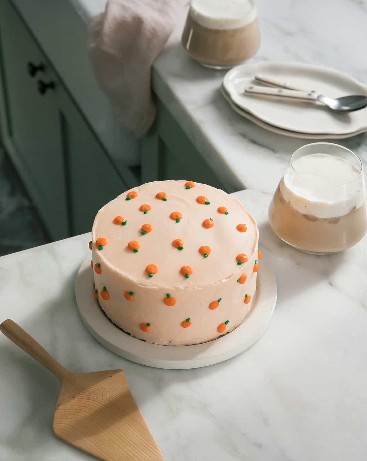 Creamsicle Cake on counter with coffee. 