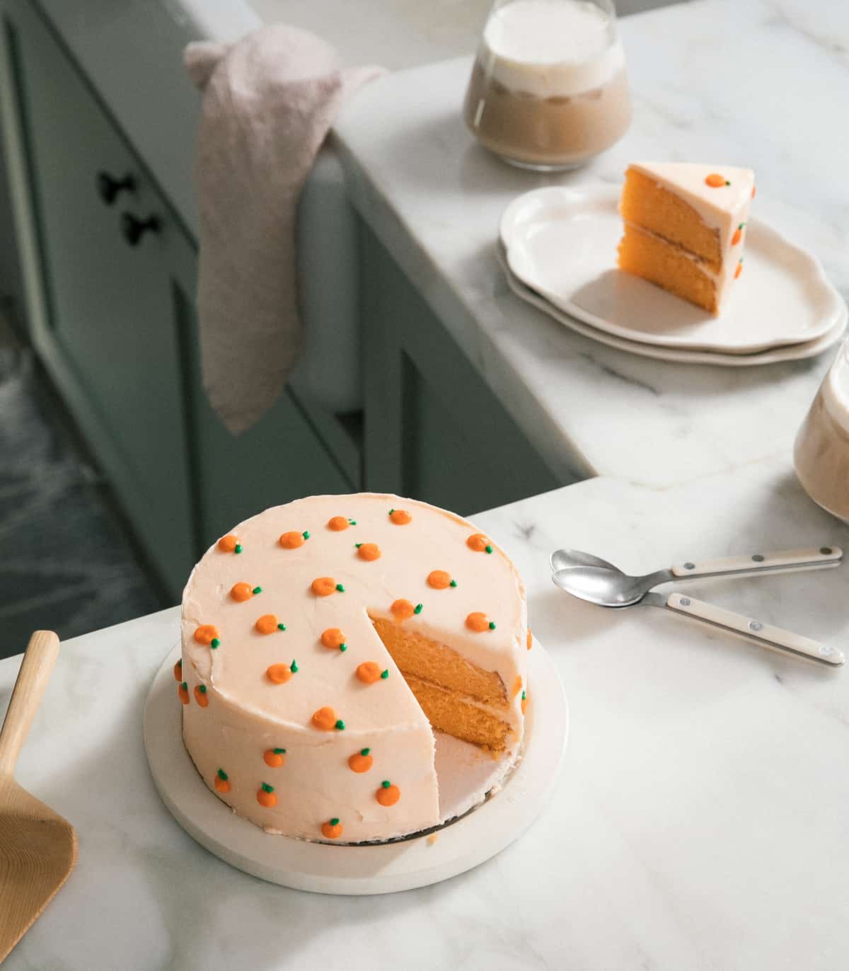Creamsicle Cake with slice taken out on counter. 