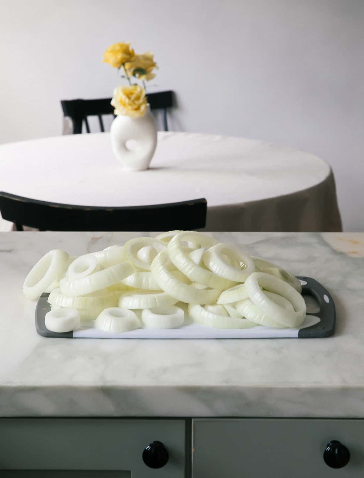 Vidalia Onion Slices on Cutting Board.