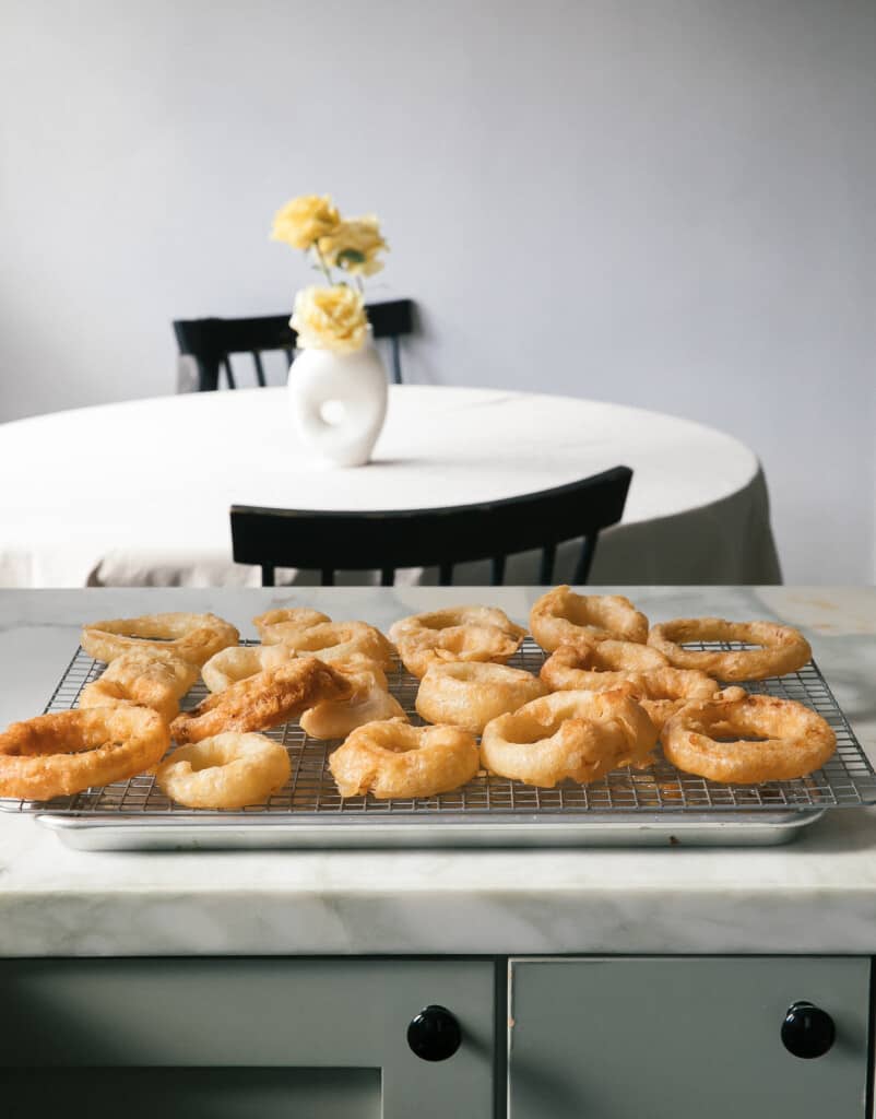 Beer-Battered Vidalia Onion Rings on cooling rack