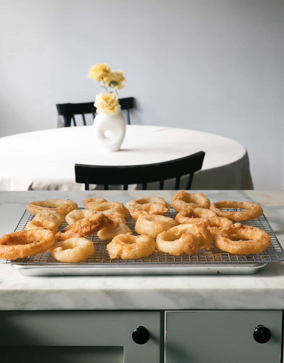 Beer Battered Onion Rings on cooling rack.