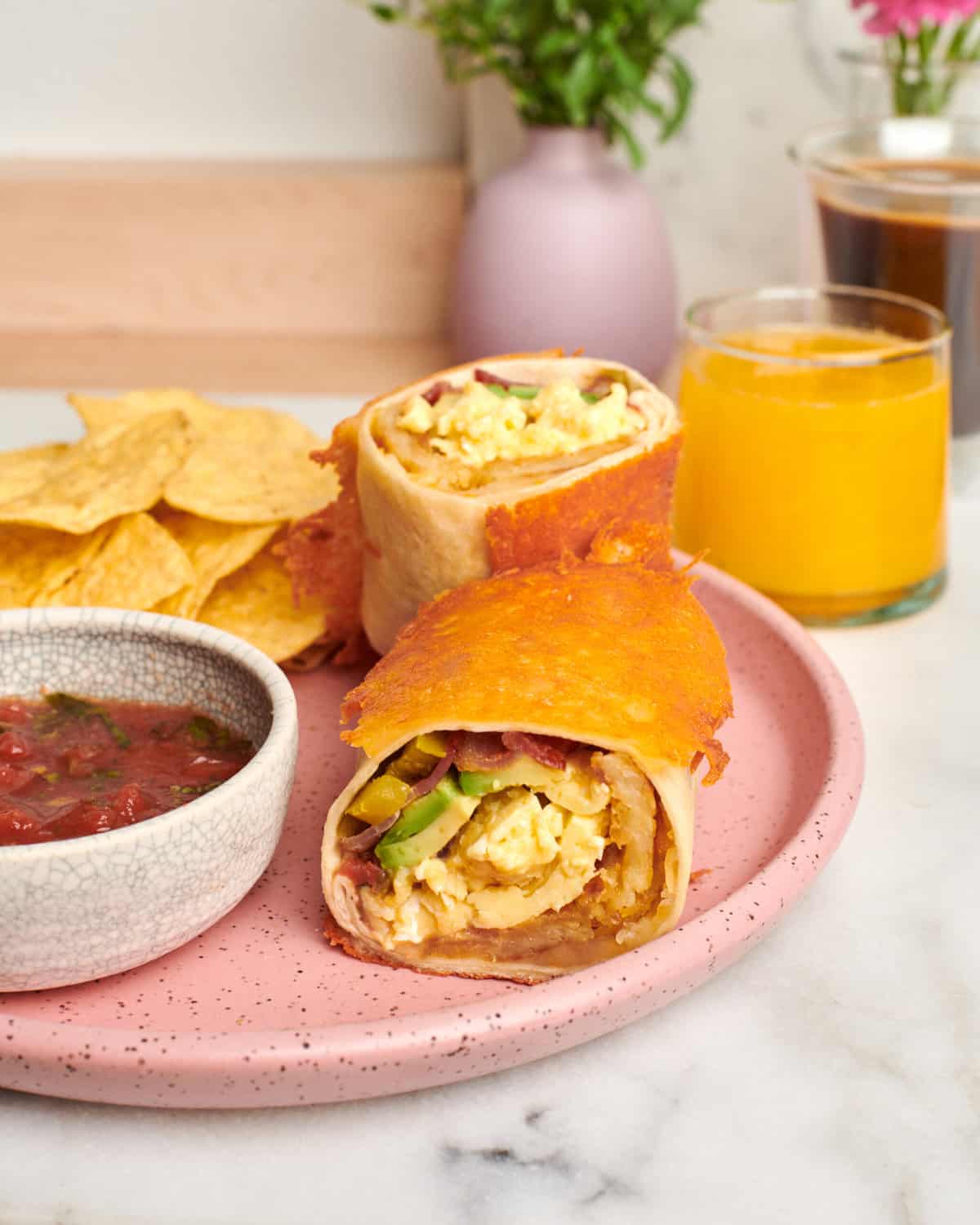 Breakfast Burrito on a plate with salsa. 
