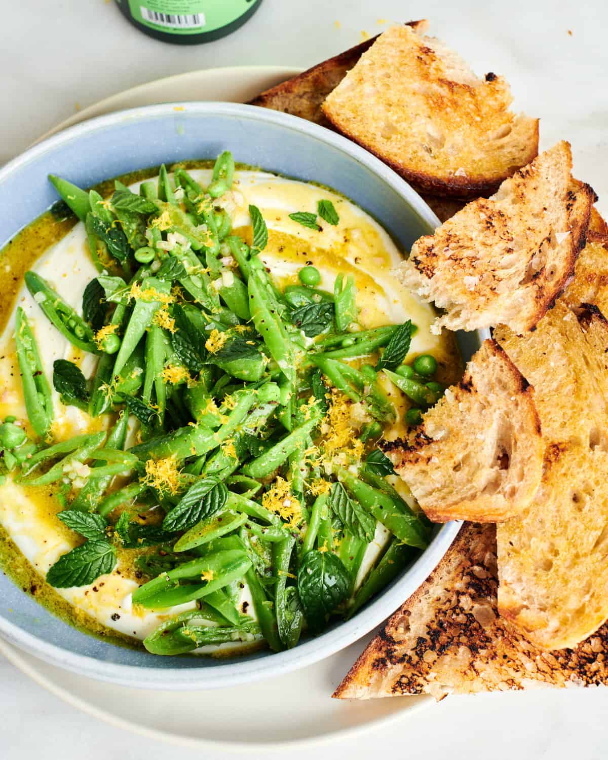 Whipped Feta Dip with Sugar Snap Peas on top. 