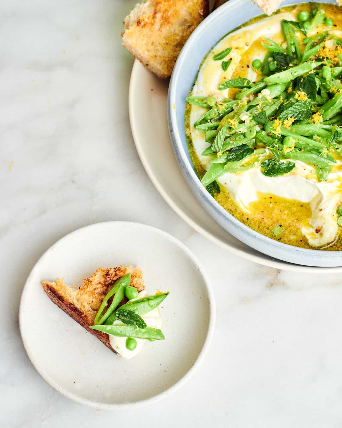 Whipped Feta Dip on a piece of bread. 