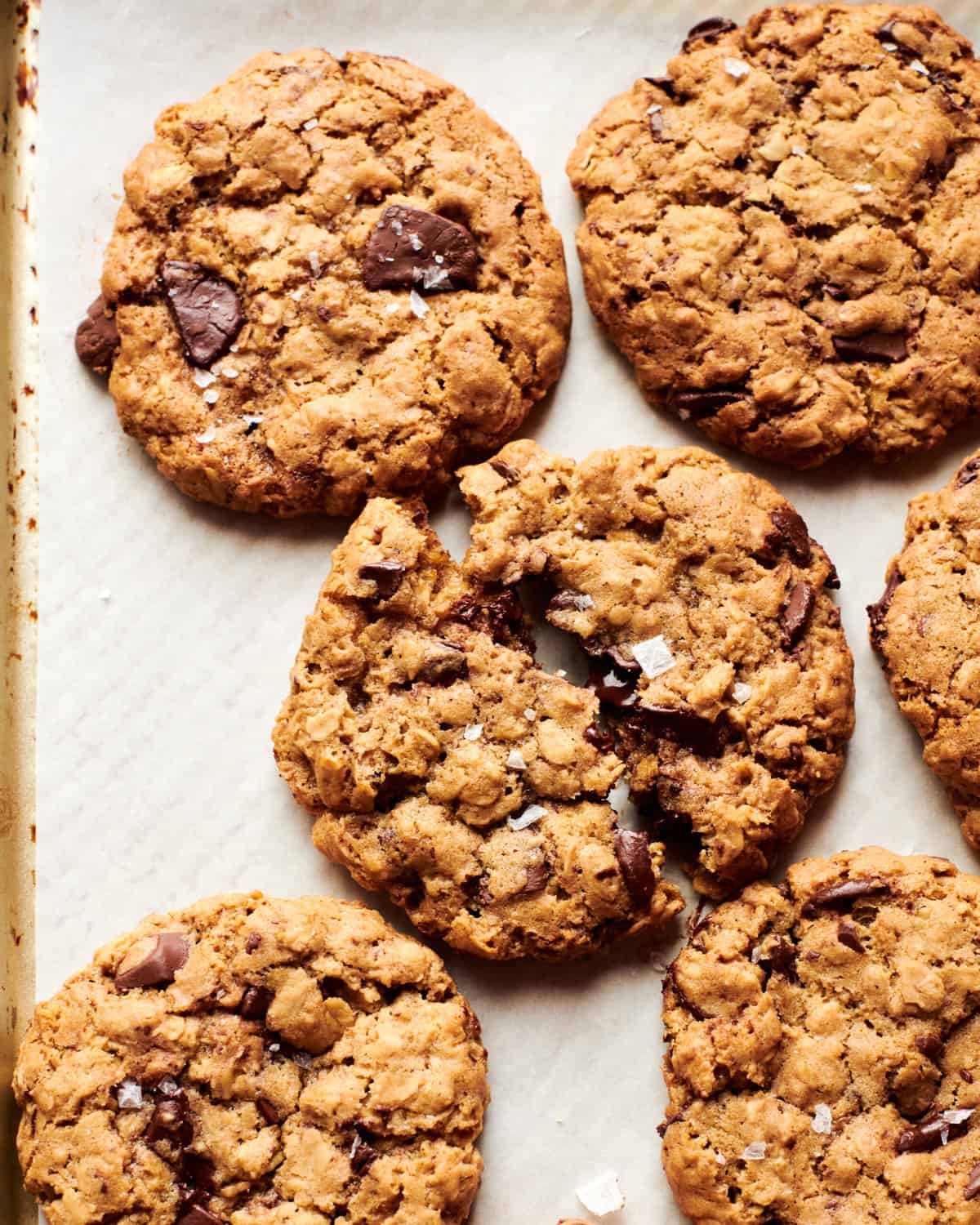 Oatmeal Chocolate Chip Cookies on on plate with flakey sea salt. 