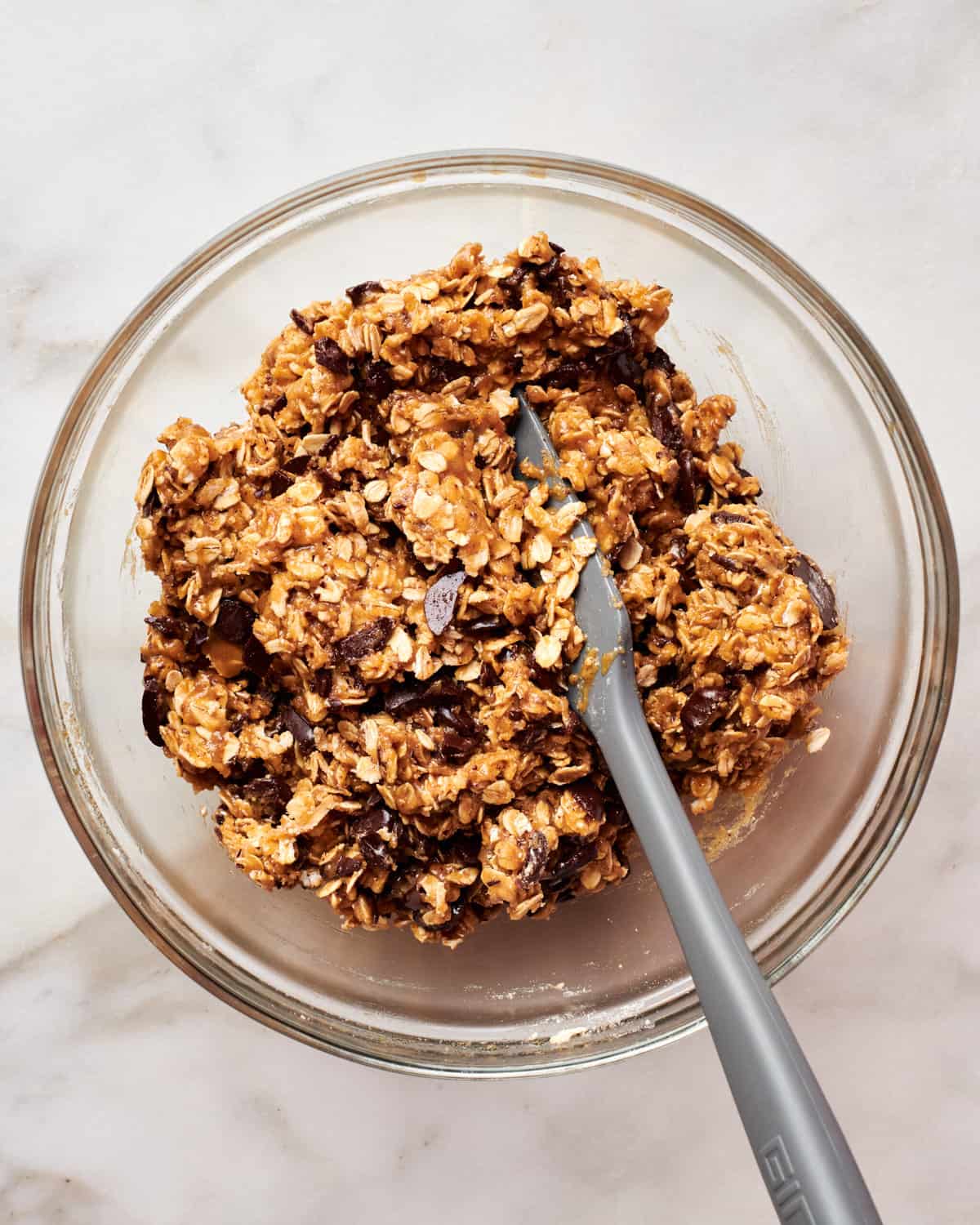 Dough for cookies in a bowl with a spatula. 