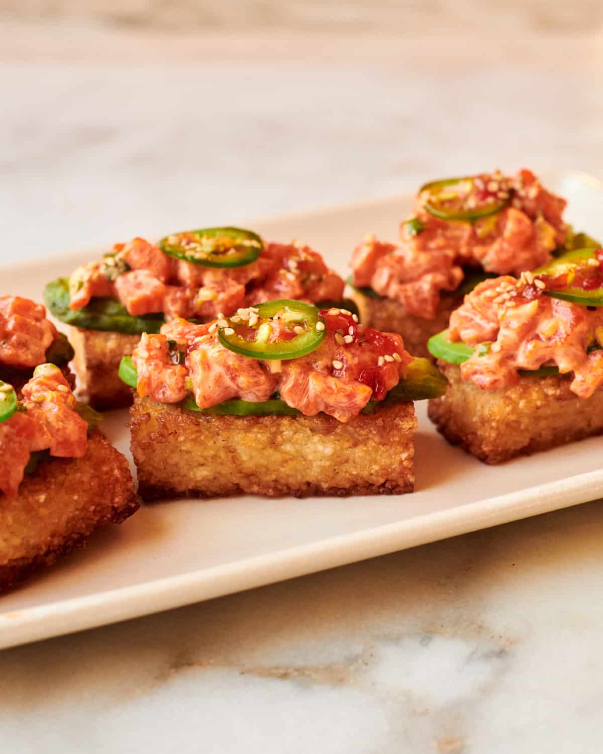 Crispy Rice with Spicy Salmon on platter. 