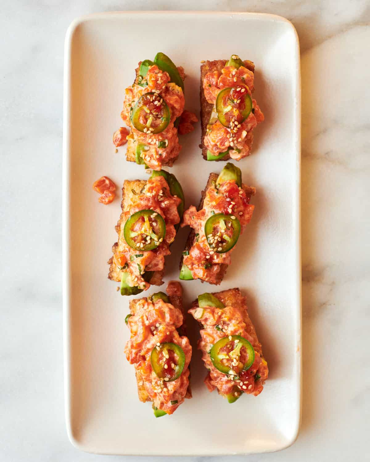 Crispy Rice with Spicy Salmon on platter. 