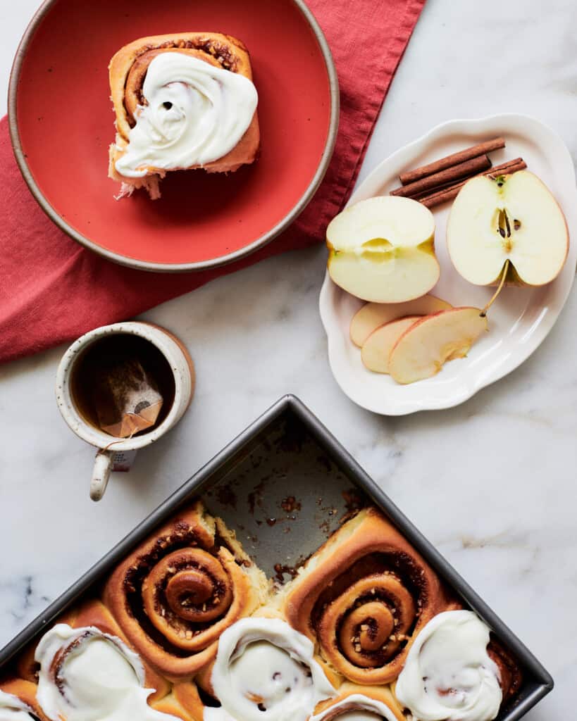 Apple cinnamon rolls on plates. 