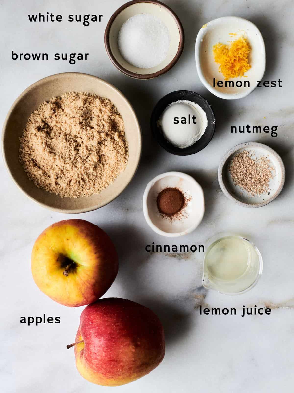 ingredients in small bowls for apple hand pies. 