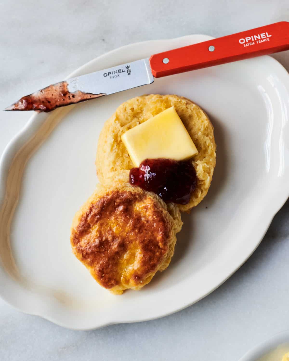 Buttermilk biscuit with jam and butter. 