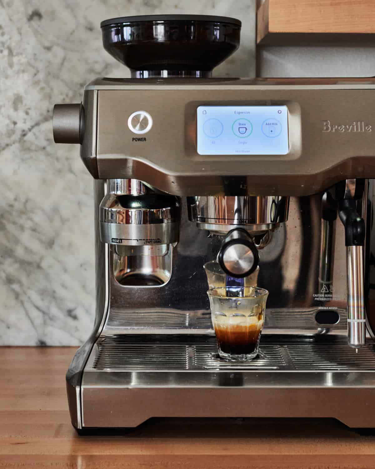 Espresso maker with espresso being brewed 