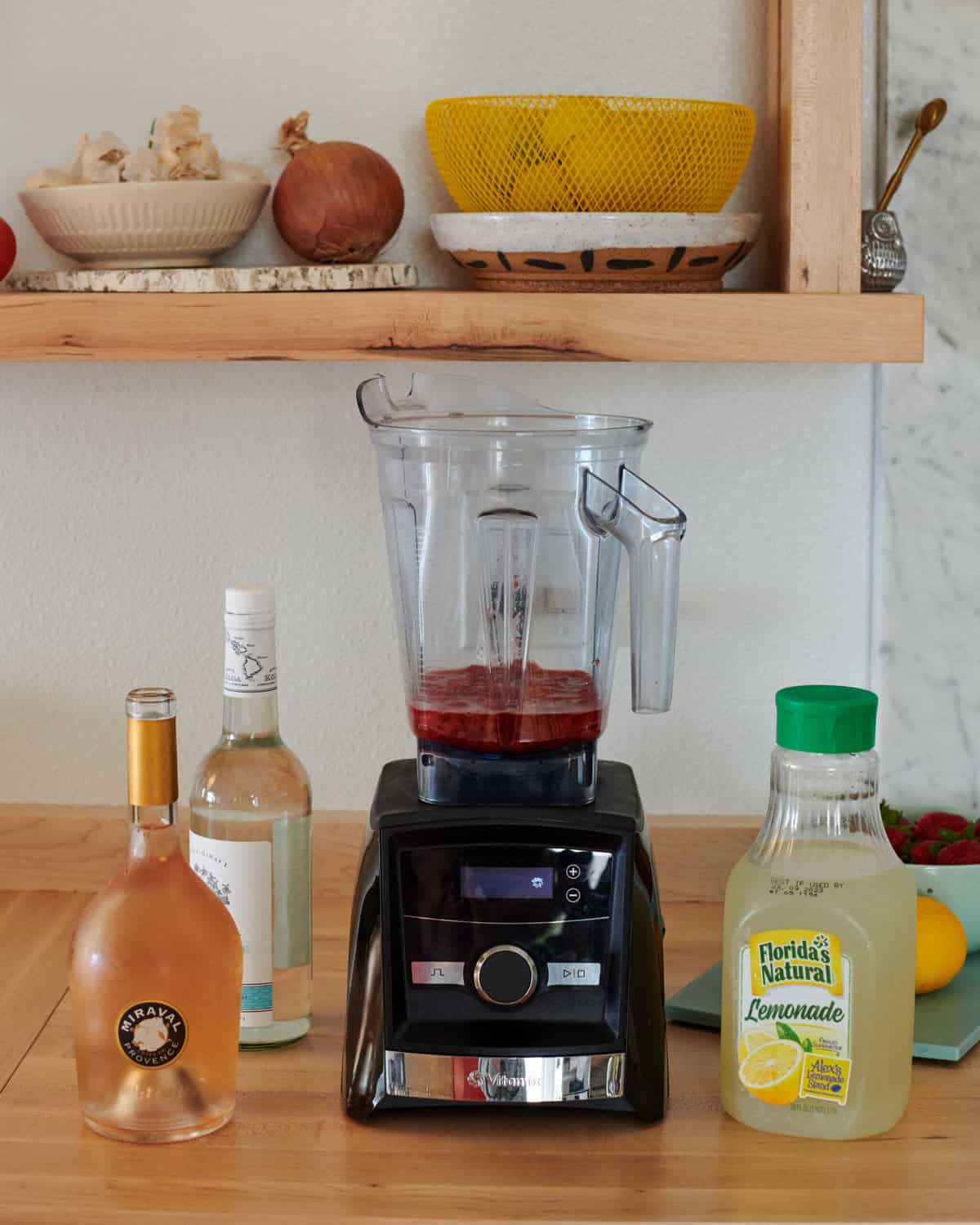 All of the blender ingredients by a blender.