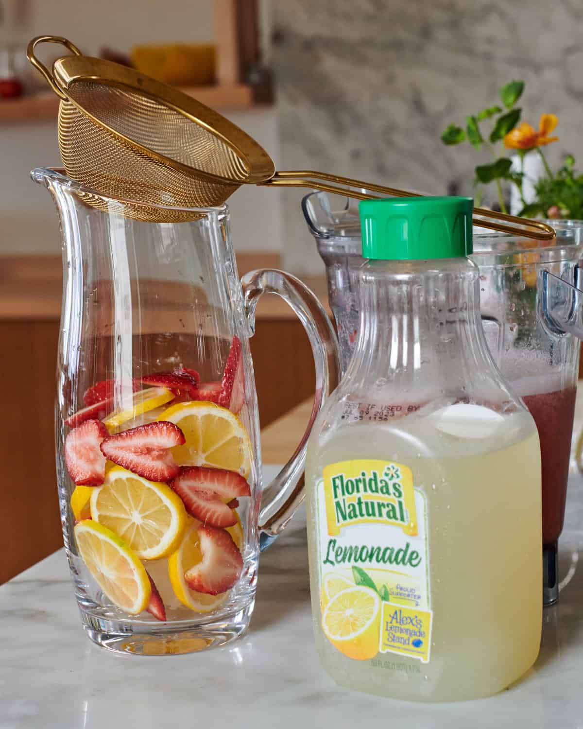 Pitcher full of fruit before the sangria is poured in.