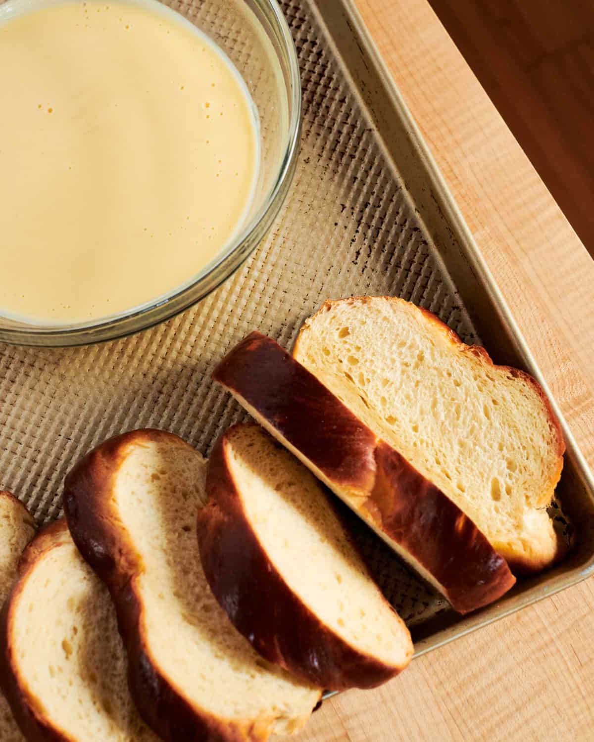 challah sliced on a baking sheet