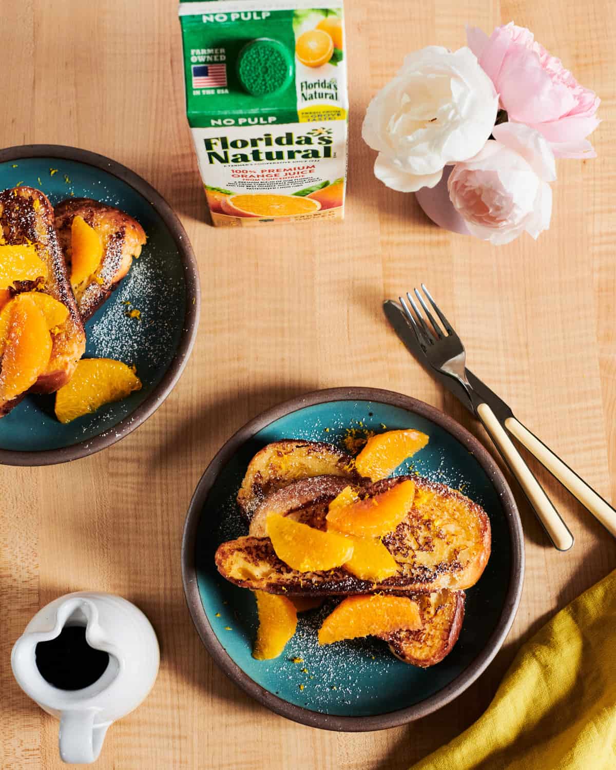 challah french toast with orange slices overhead on plates