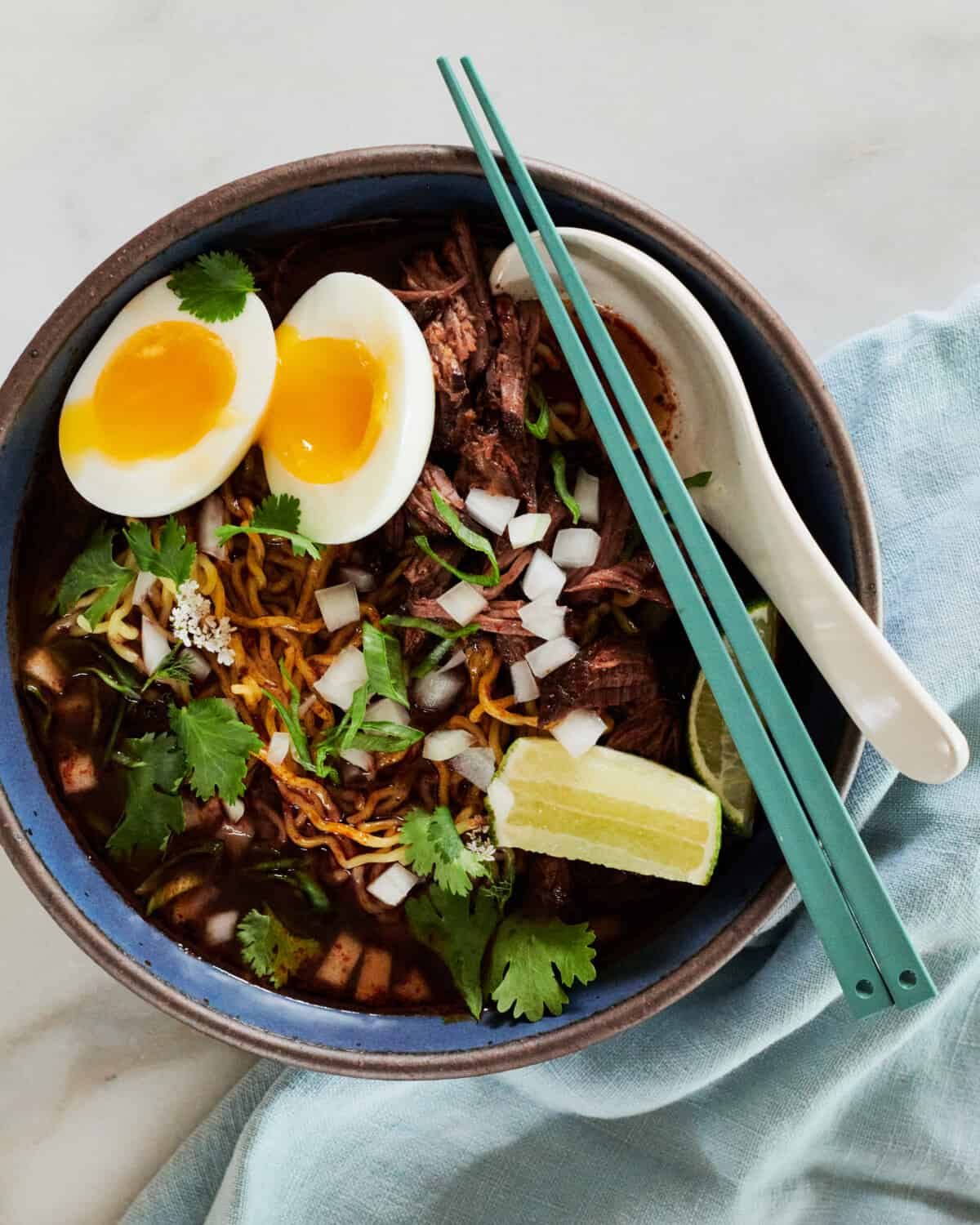 Birria Ramen recipe in bowl on counter.
