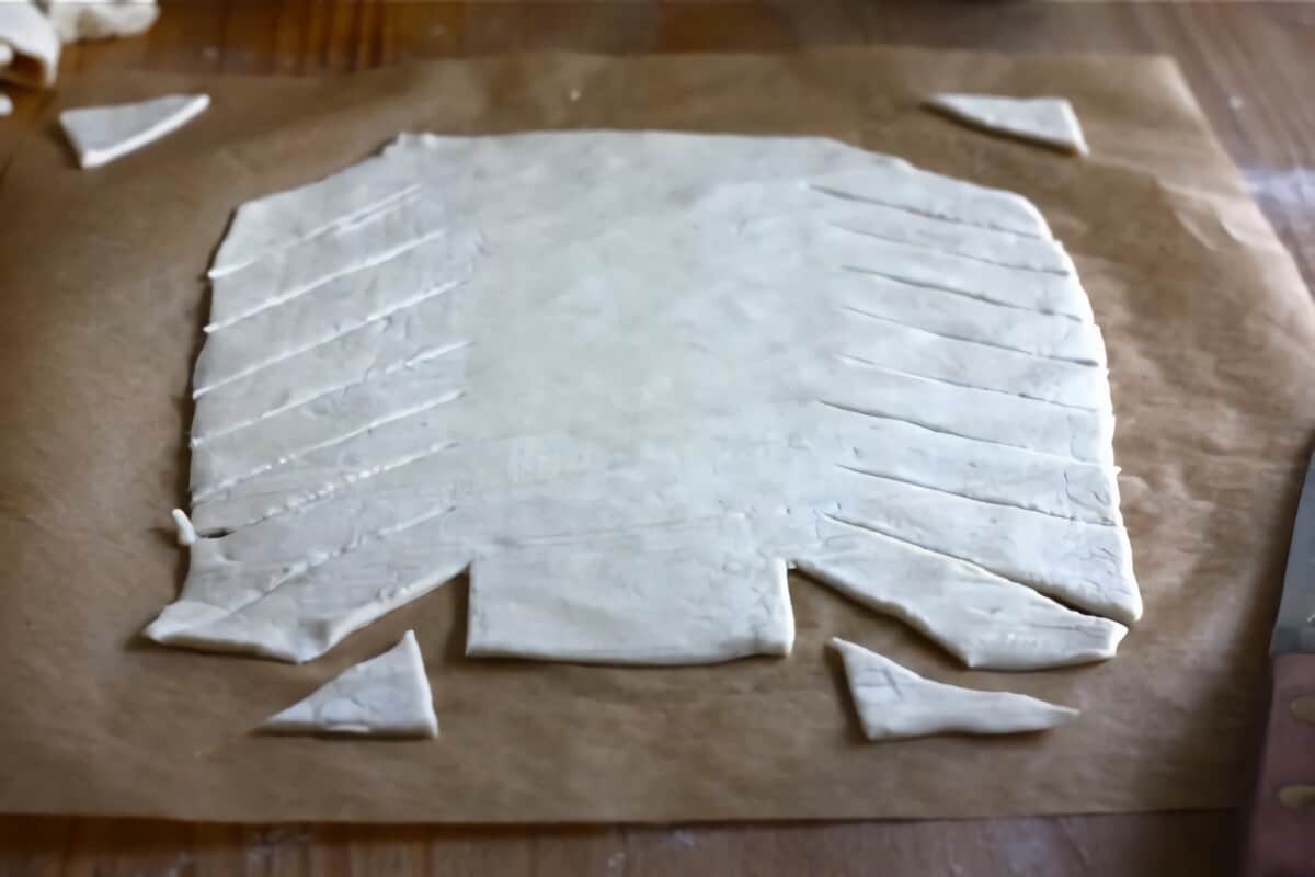 Puff pastry being cut.