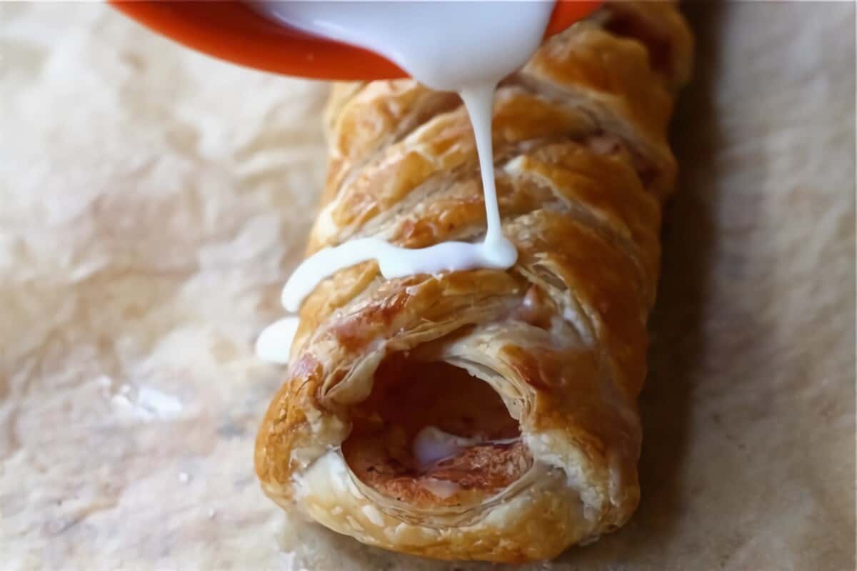 Apple Cheese Danish with a drizzle.