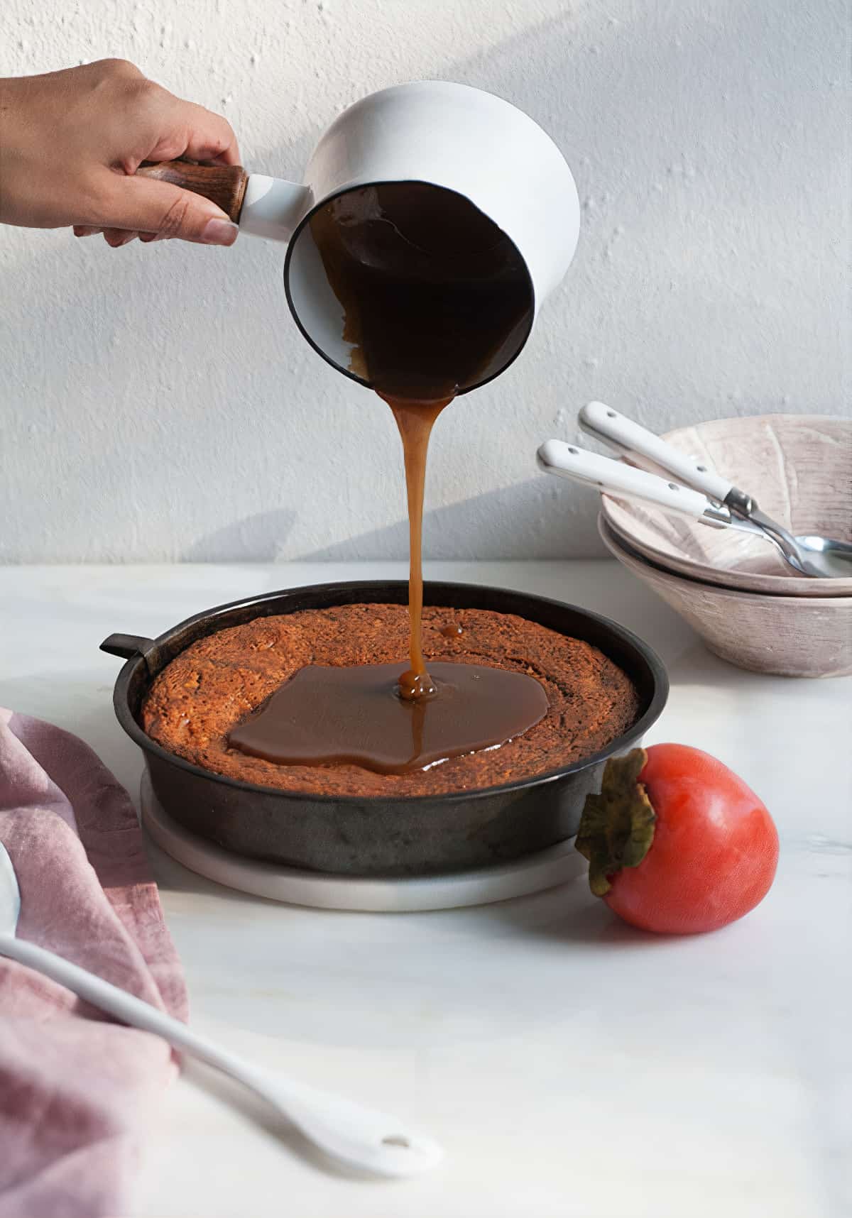 Sticky Toffee Pudding with toffee sauce poured on top. 