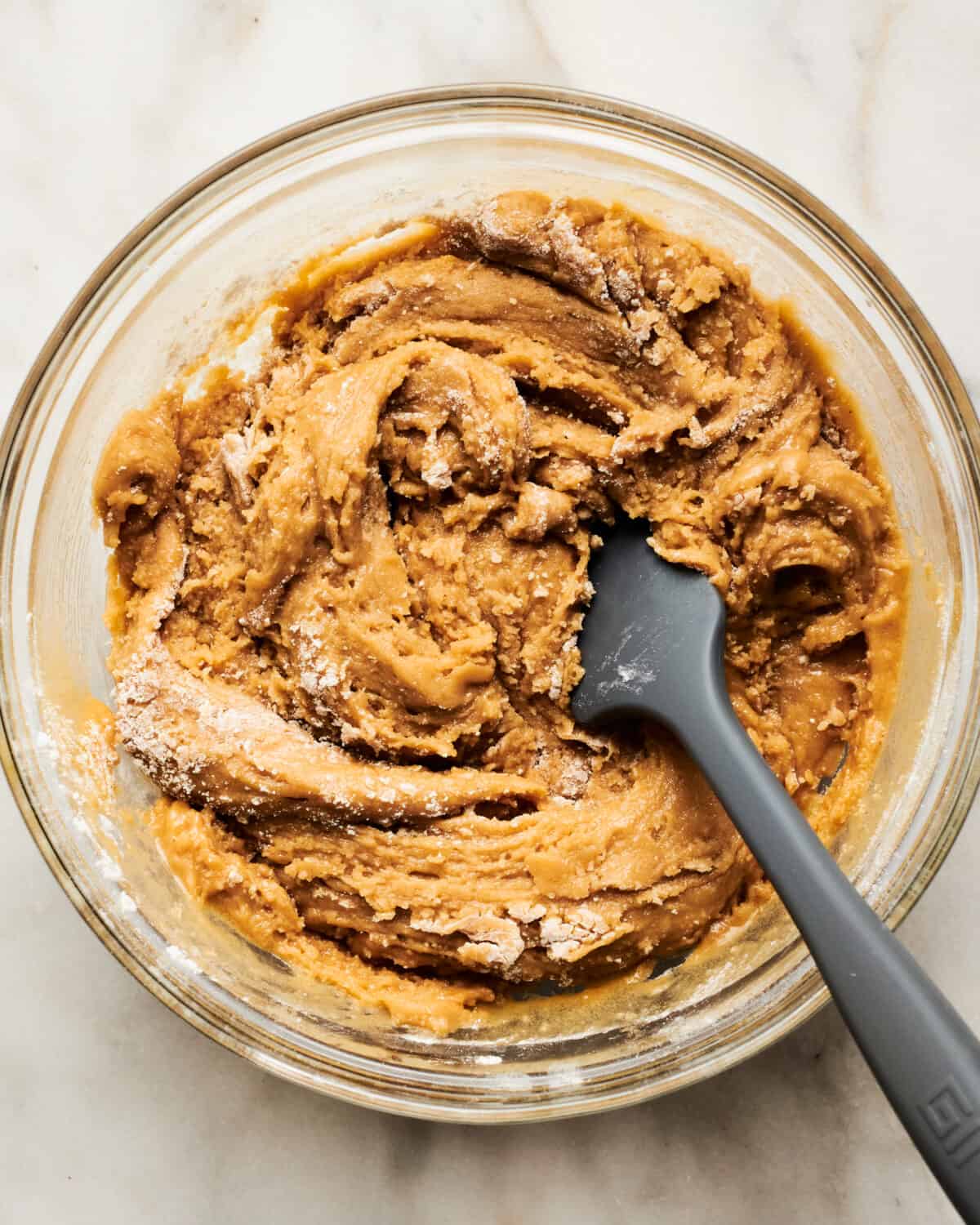 Cookie dough being mixed.