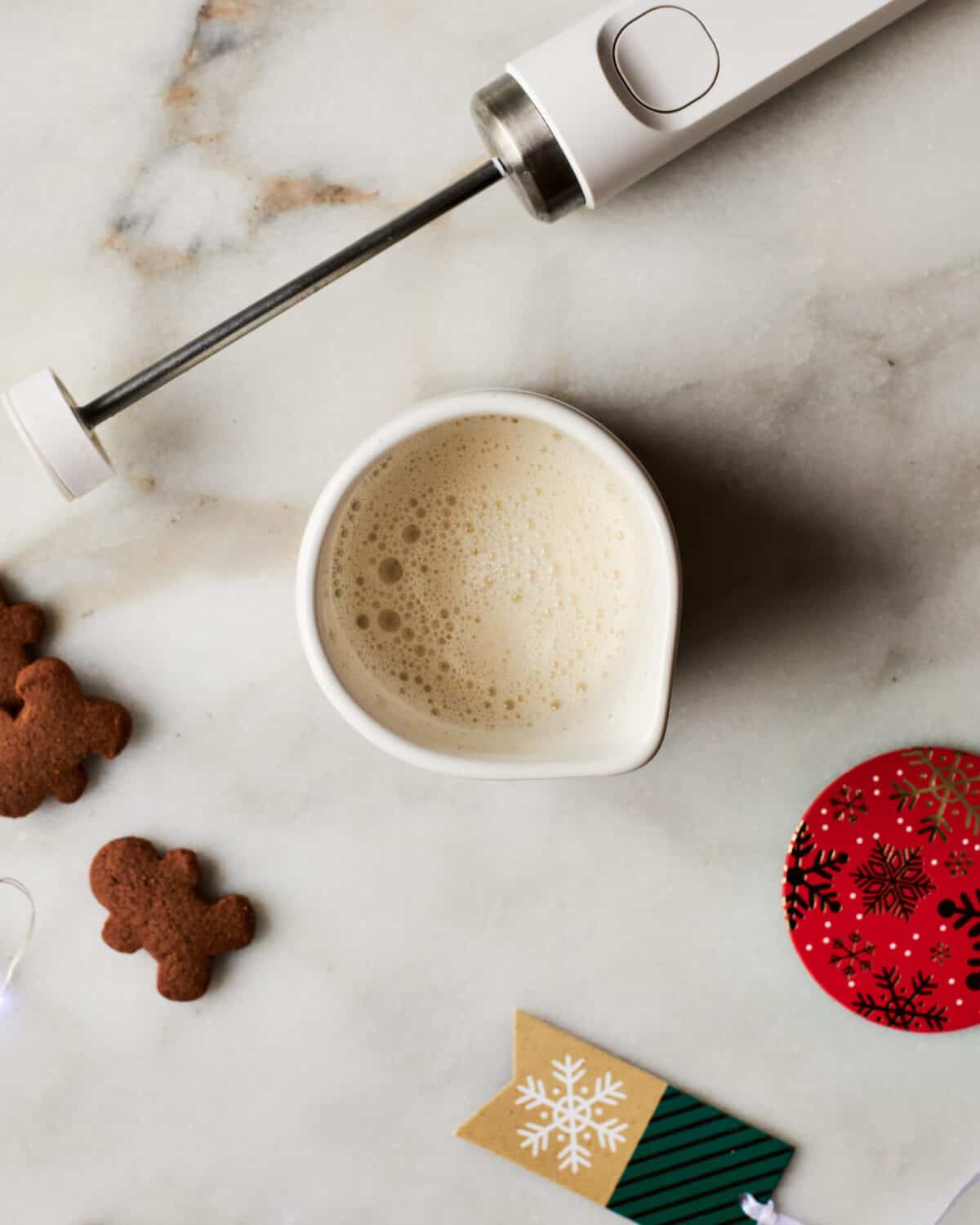 Milk being frothed in a mug for latte. 