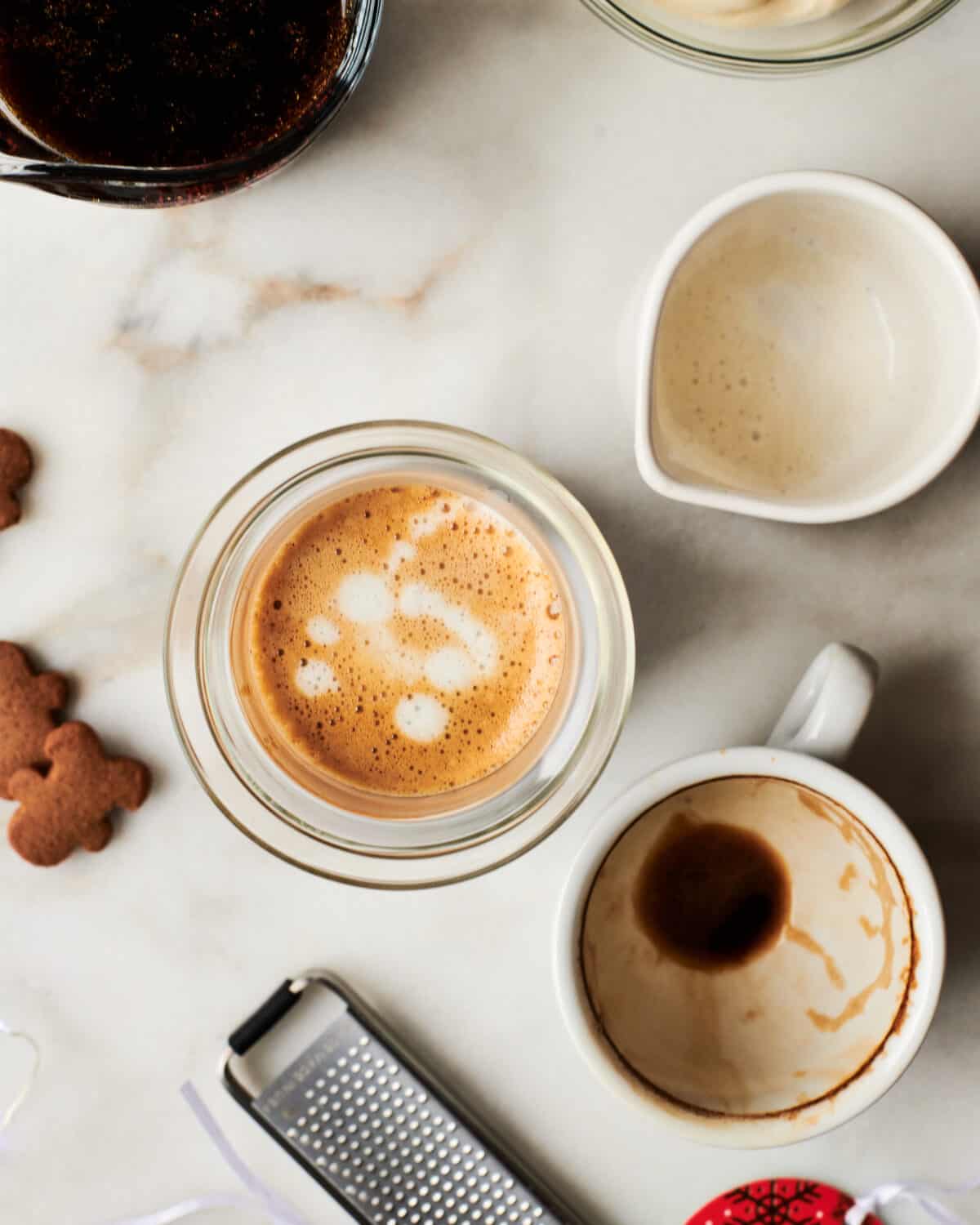 Gingerbread latte being assembled in mug. 