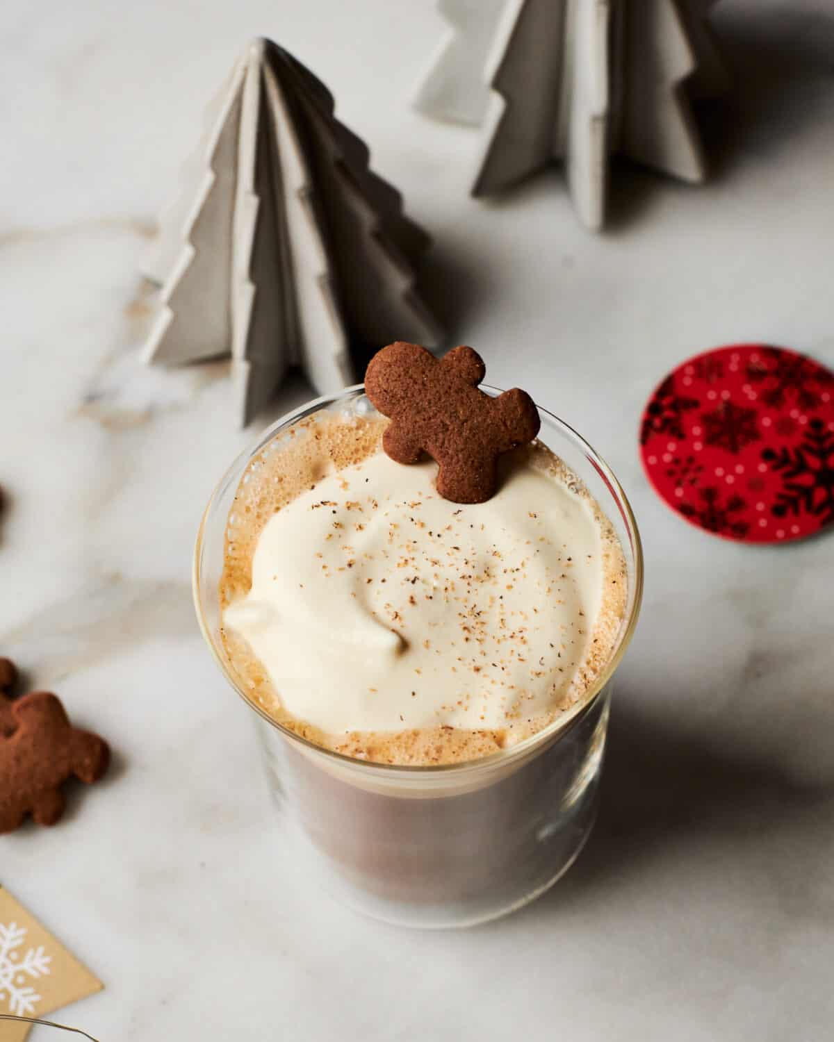 Gingrebread Latte in mug with gingerbread cookie on top. 