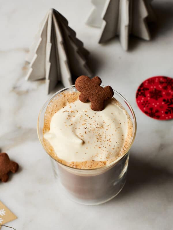 Gingrebread Latte in mug with gingerbread cookie on top.