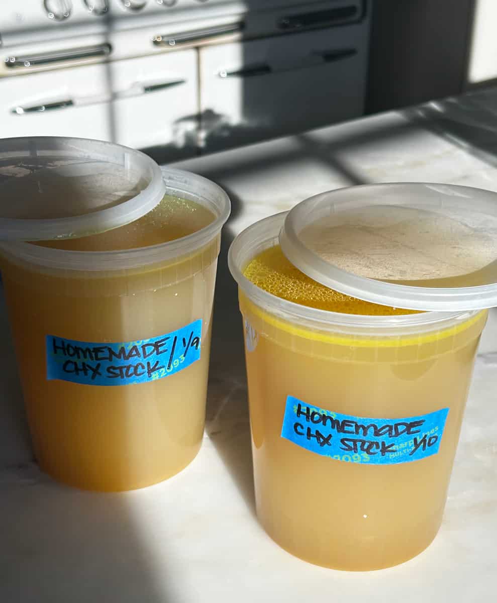Quart containers of chicken stock.