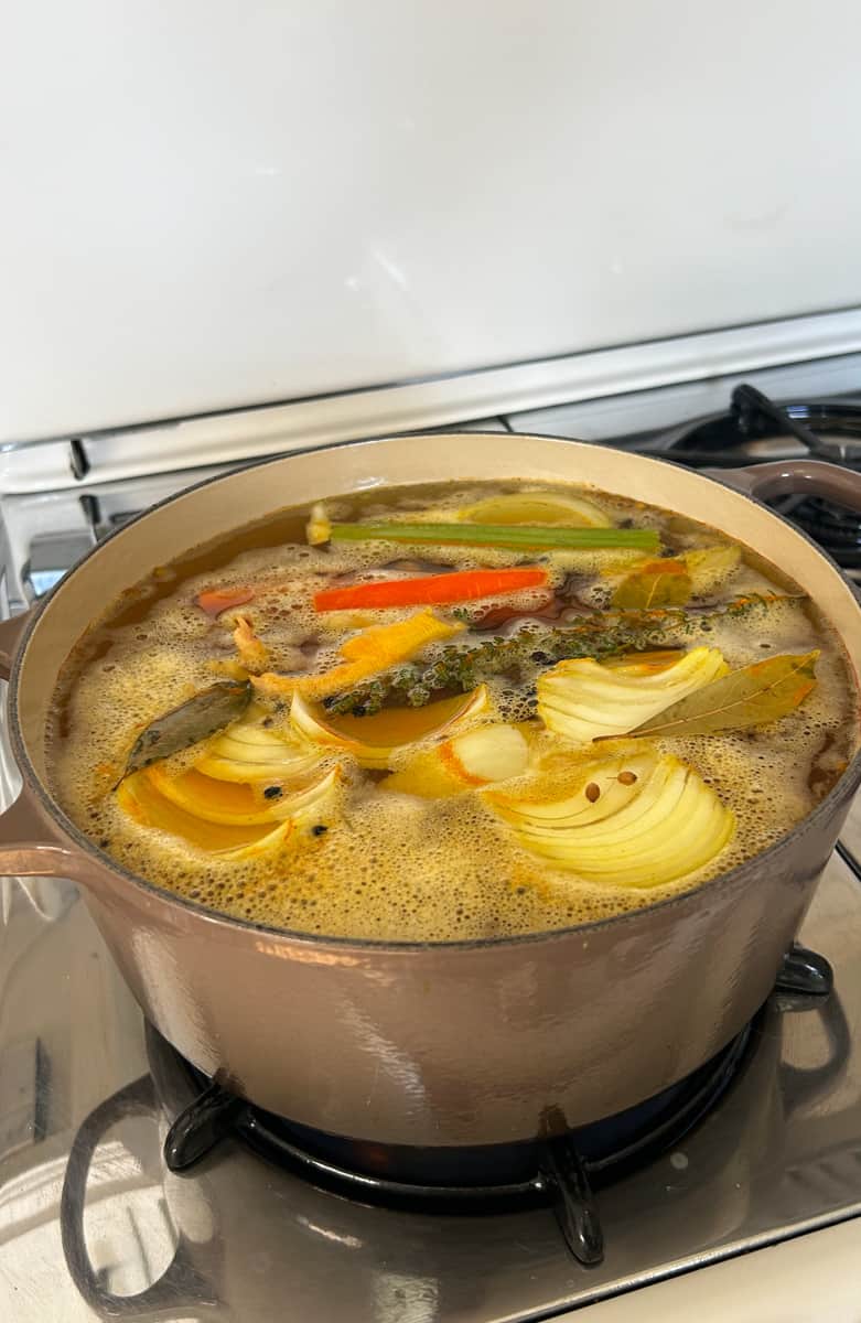 Chicken stock with all of the ingredients added. 
