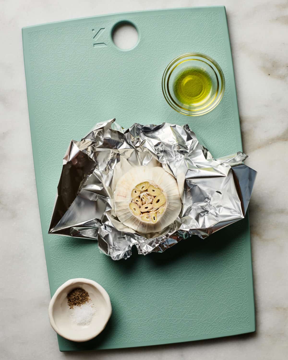 Garlic being roasted with olive oil. 