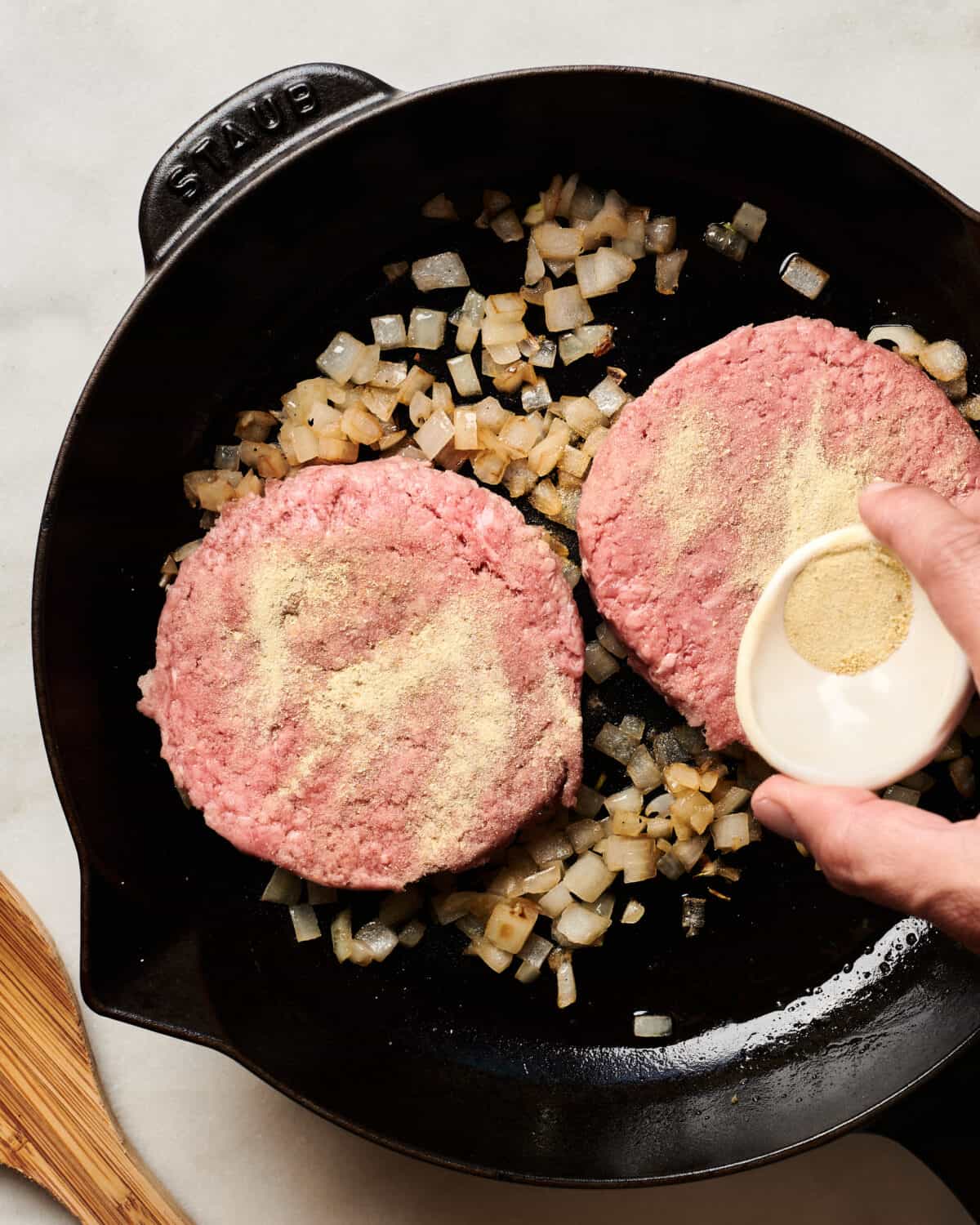 Adobo Sazon added to beef patties. 