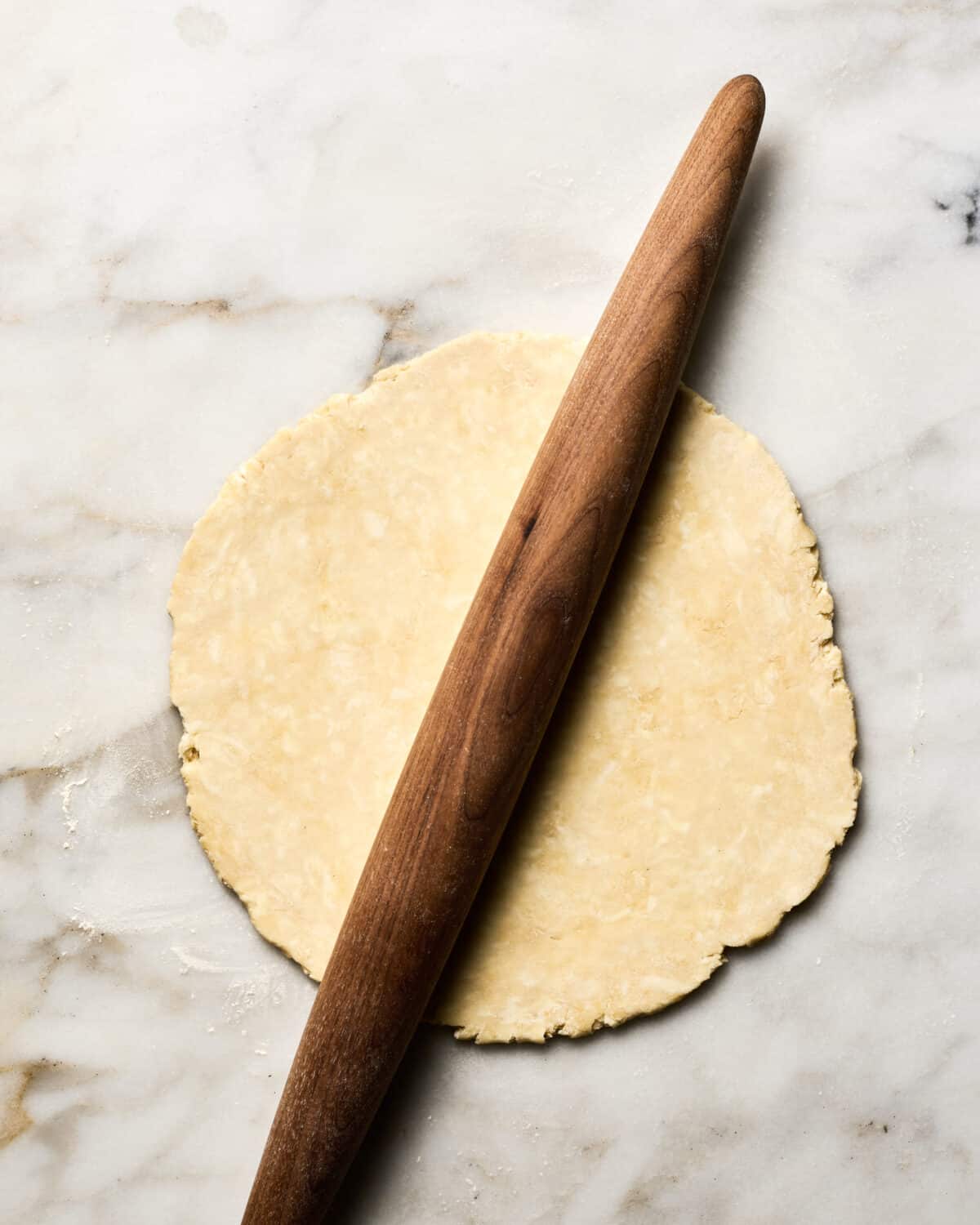 Pie crust being rolled out. 