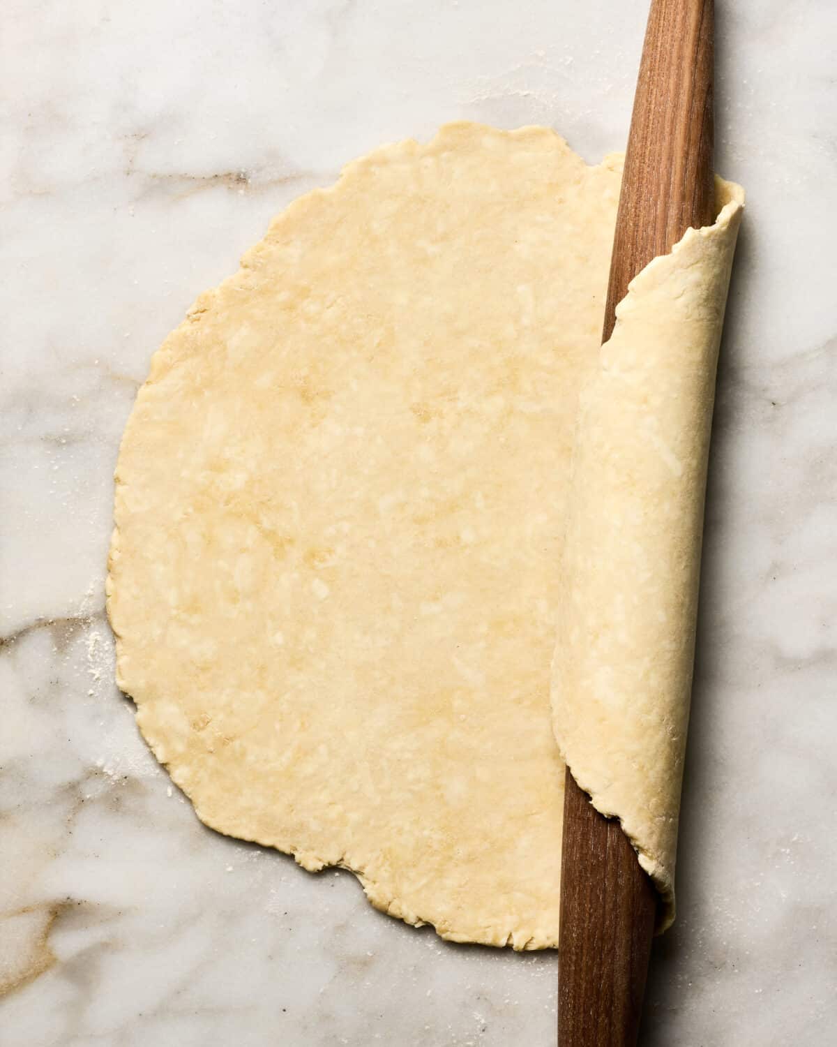 Rolled out pie crust on the counter. 