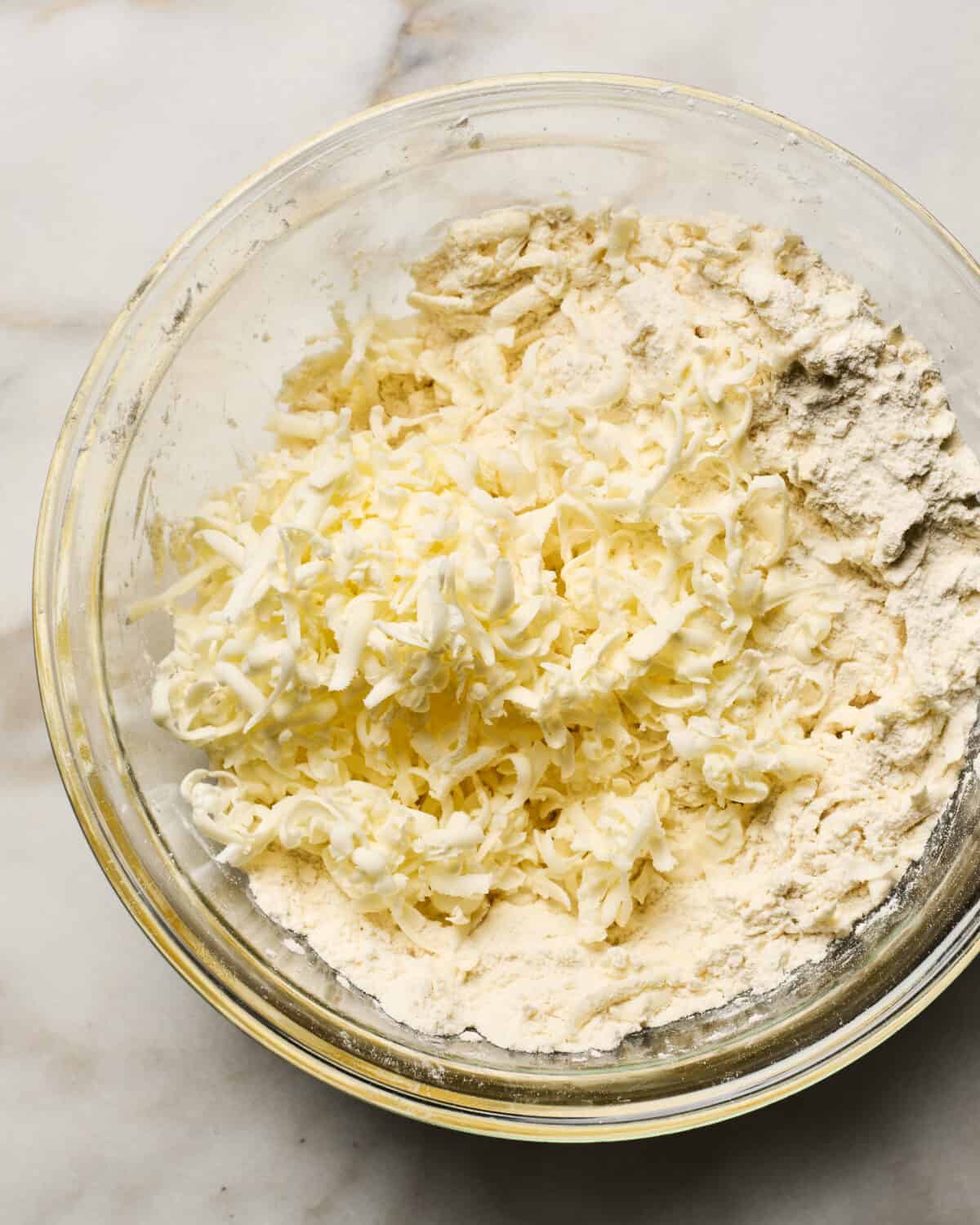 Grated butter on top of dry ingredients. 