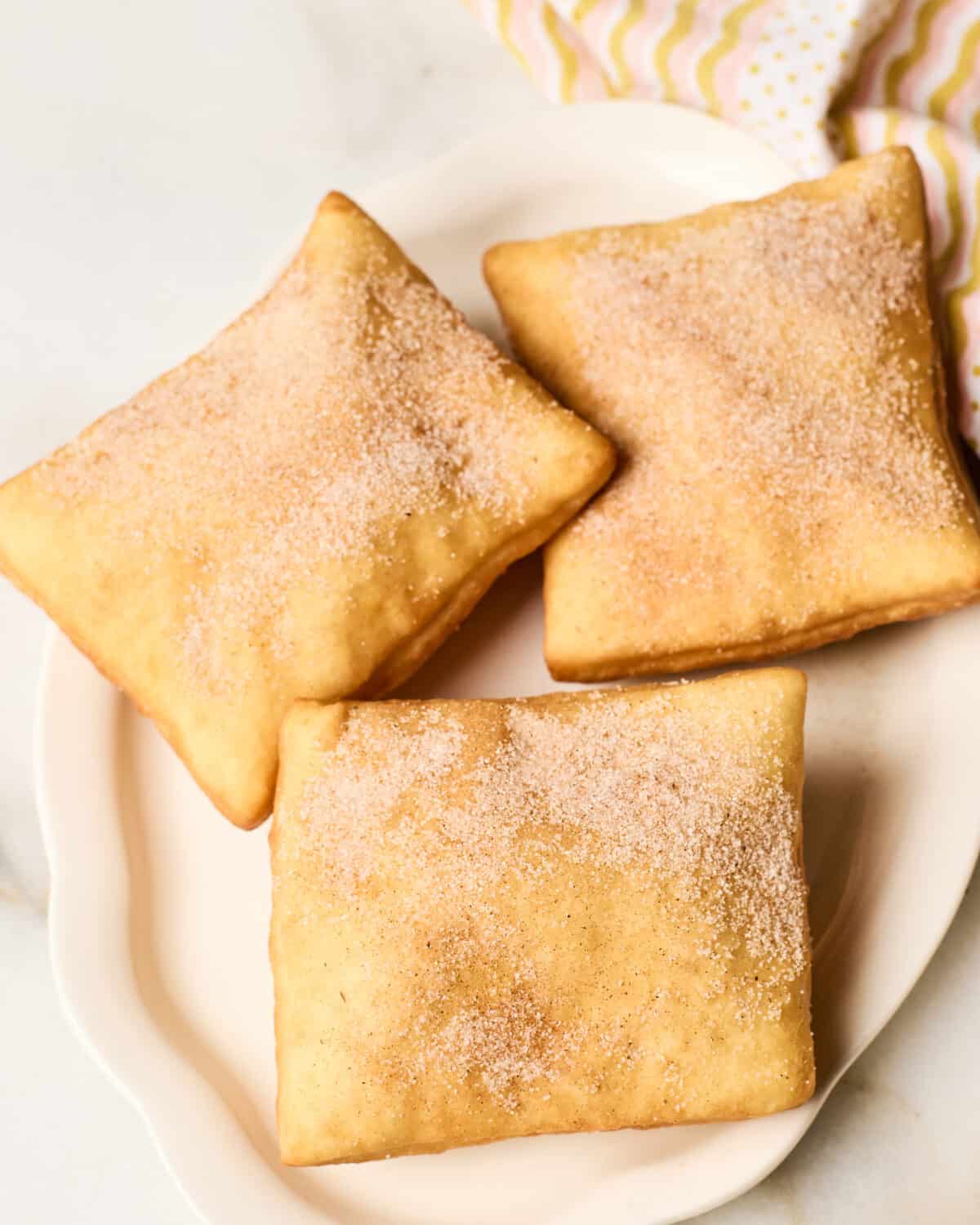 Sopapillas tossed with sugar and cinnamon. 