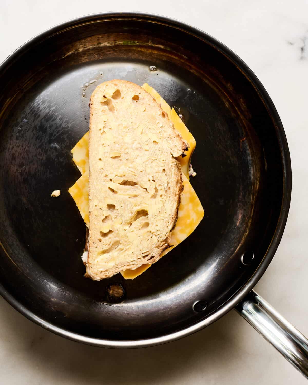 Tuna melt in a pan before it's cooked. 