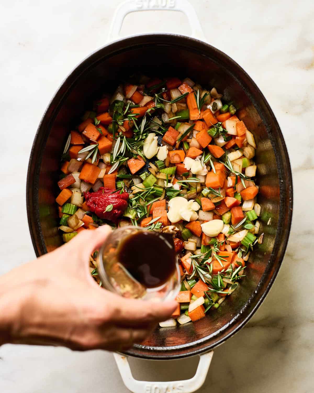 Vegetables being added. 