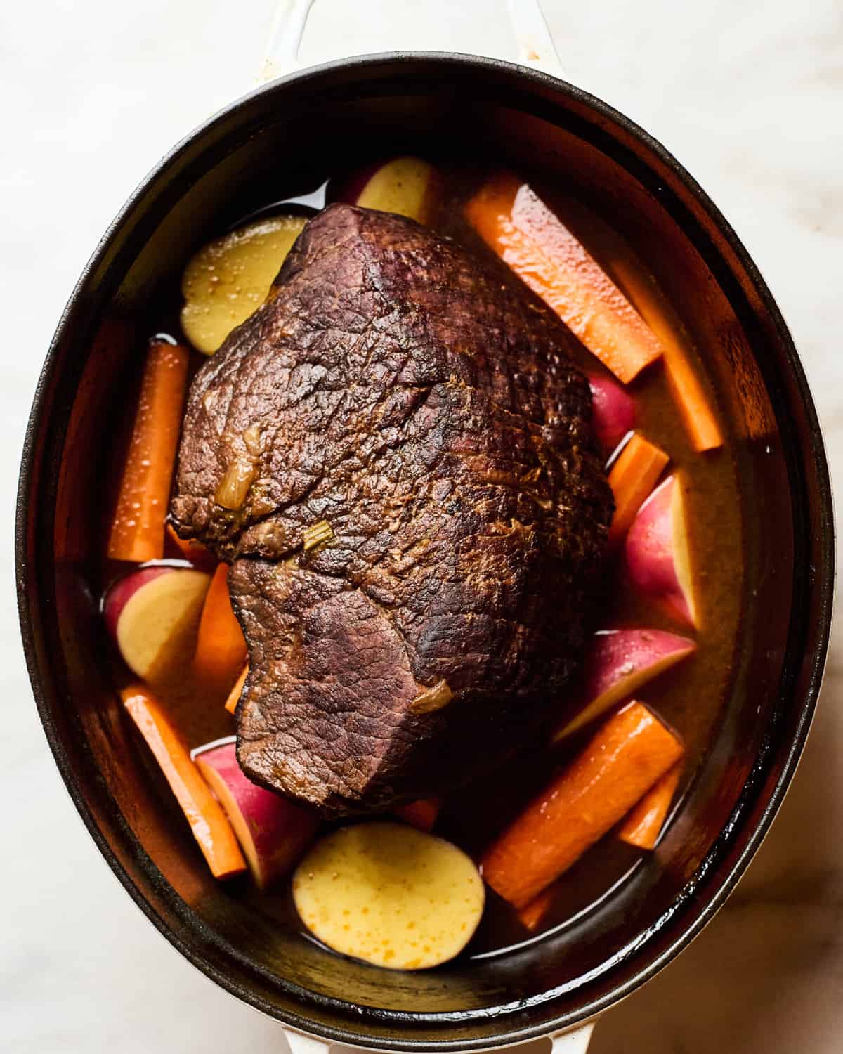 Whole pot roast in a pot. 