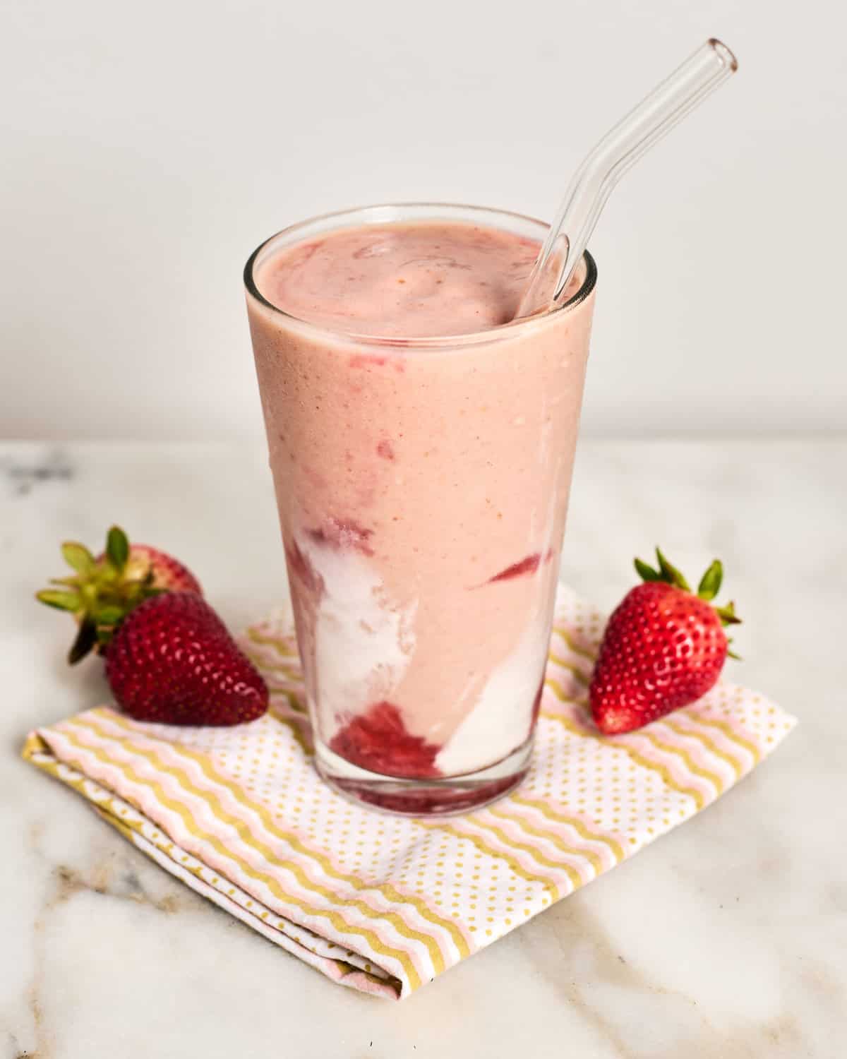 Hailey Bieber Strawberry Glaze Skin Smoothie in glass. 