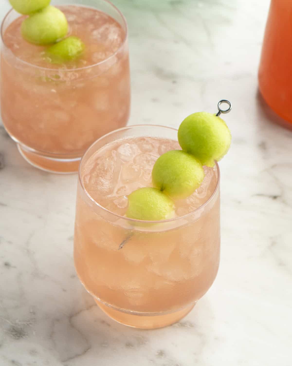 Honey Deuce Cocktail with melon balls on top as garnish