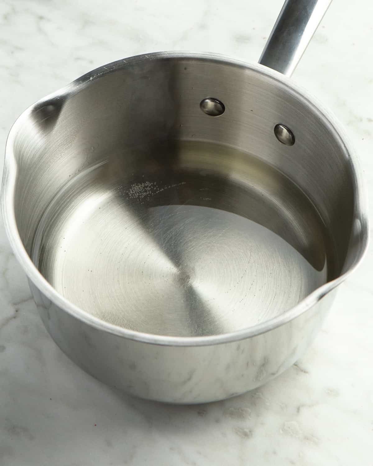 Simple syrup being made in pan. 