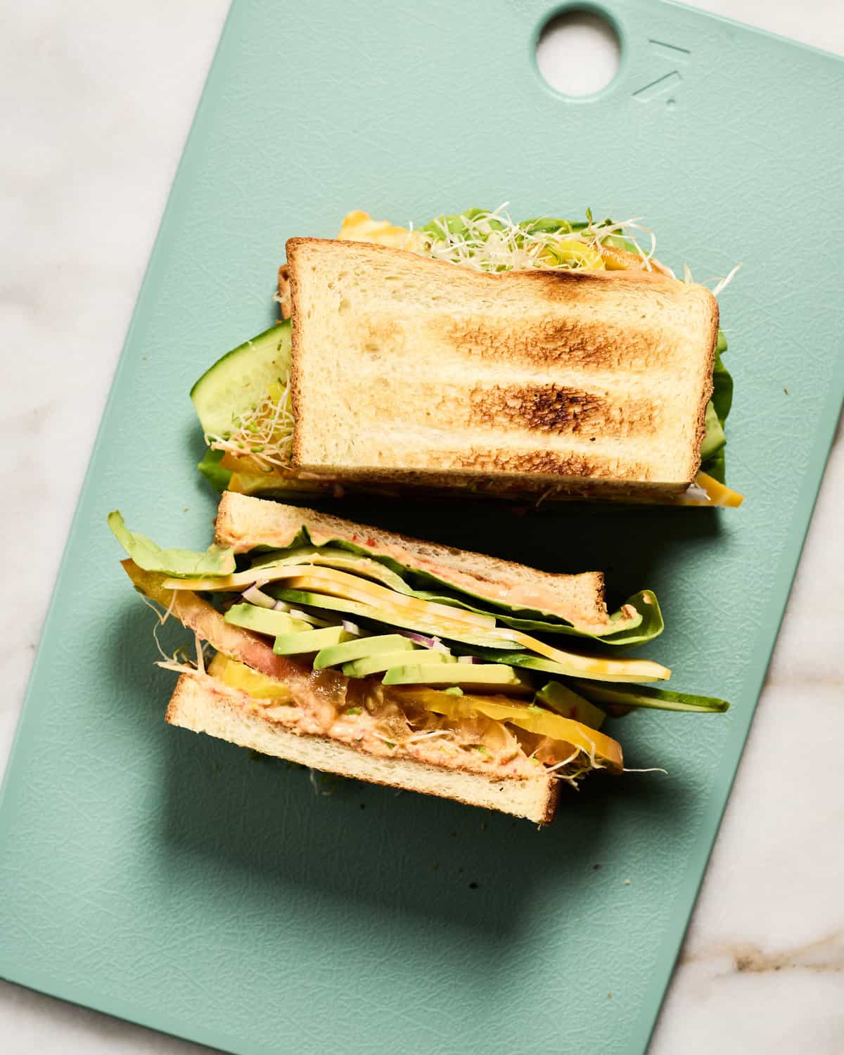 Veggie Sandwich on a cutting board. 