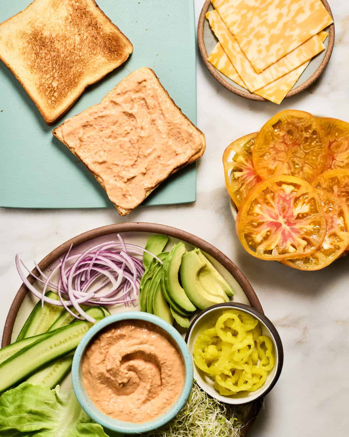 Assembling the veggie sandwich.