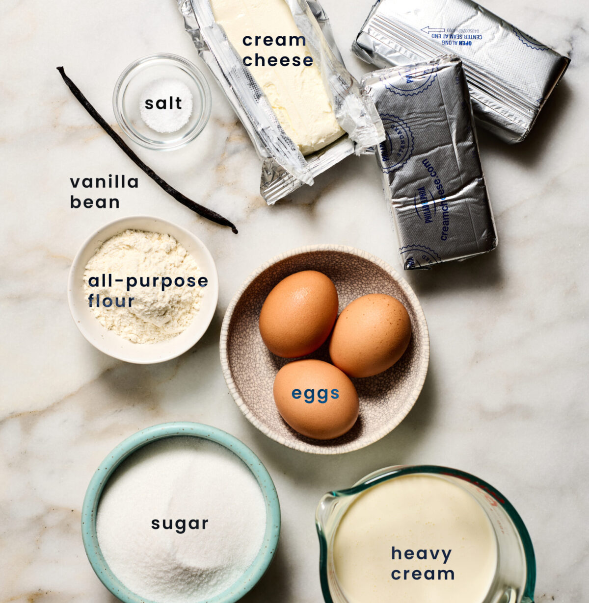 Ingredients for Basque Cheesecake: cream cheese, salt, vanilla bean, eggs, all-purpose flour, sugar and heavy cream.