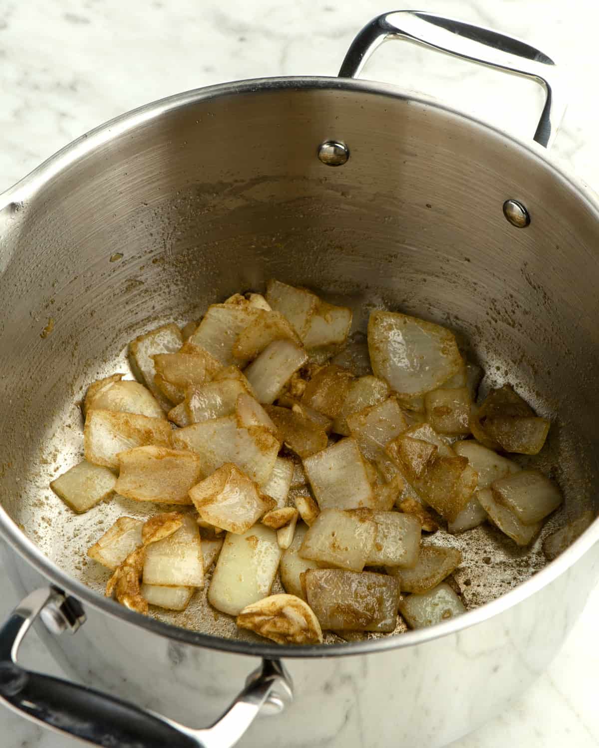 Sauteed onions and garlic in pot.